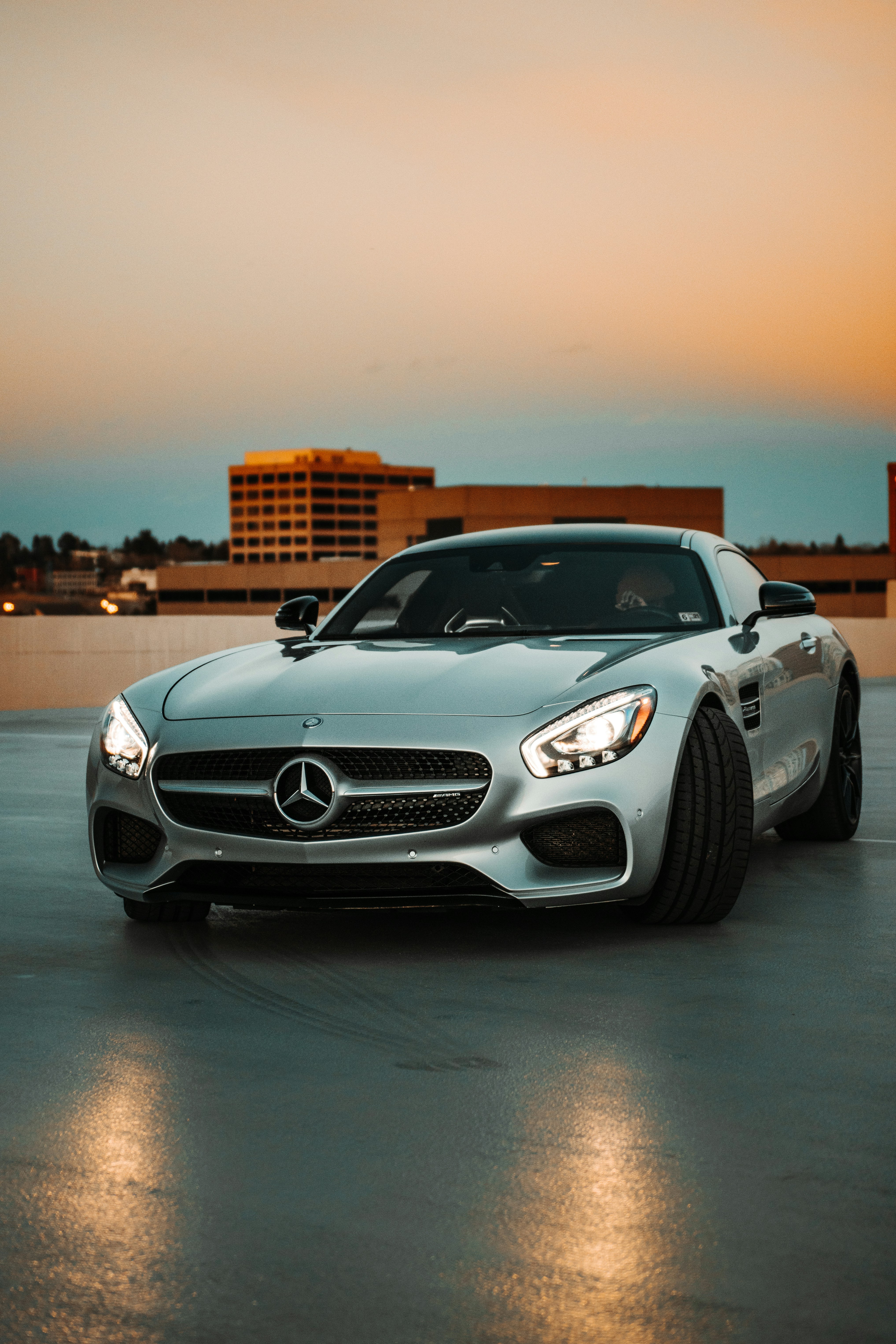 silver mercedes benz coupe on road during daytime